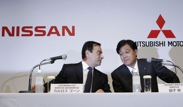Nissan Motor Chief Executive Ghosn and Mitsubishi Motors Corp President Masuko arrive at their joint news conference in Tokyo